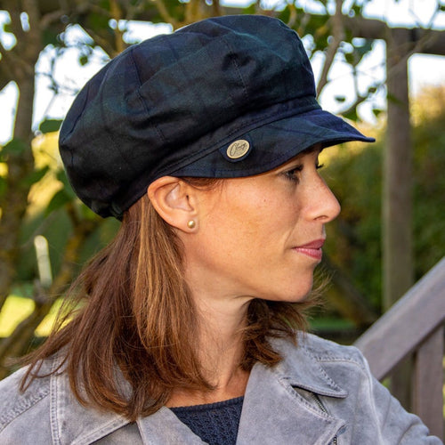 Olney Headwear Maggie Ladies Blackwatch Tartan Waxed Baker Boy Rain Hat on Woman